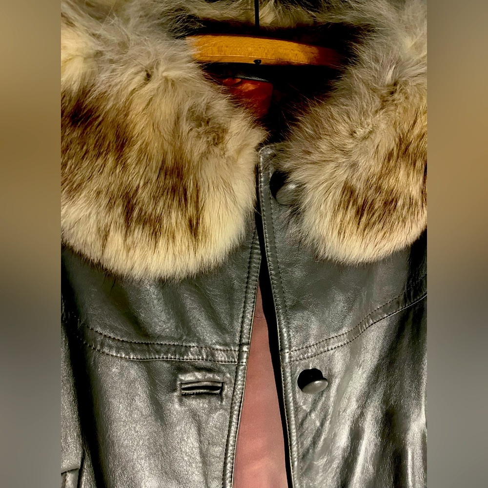 Mink and leather jacket body is leather with real mink accents